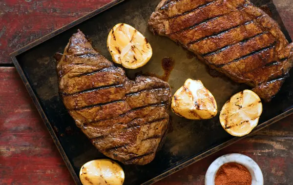 Berbere-Rubbed Rib-Eye Steaks with Grilled Lemon