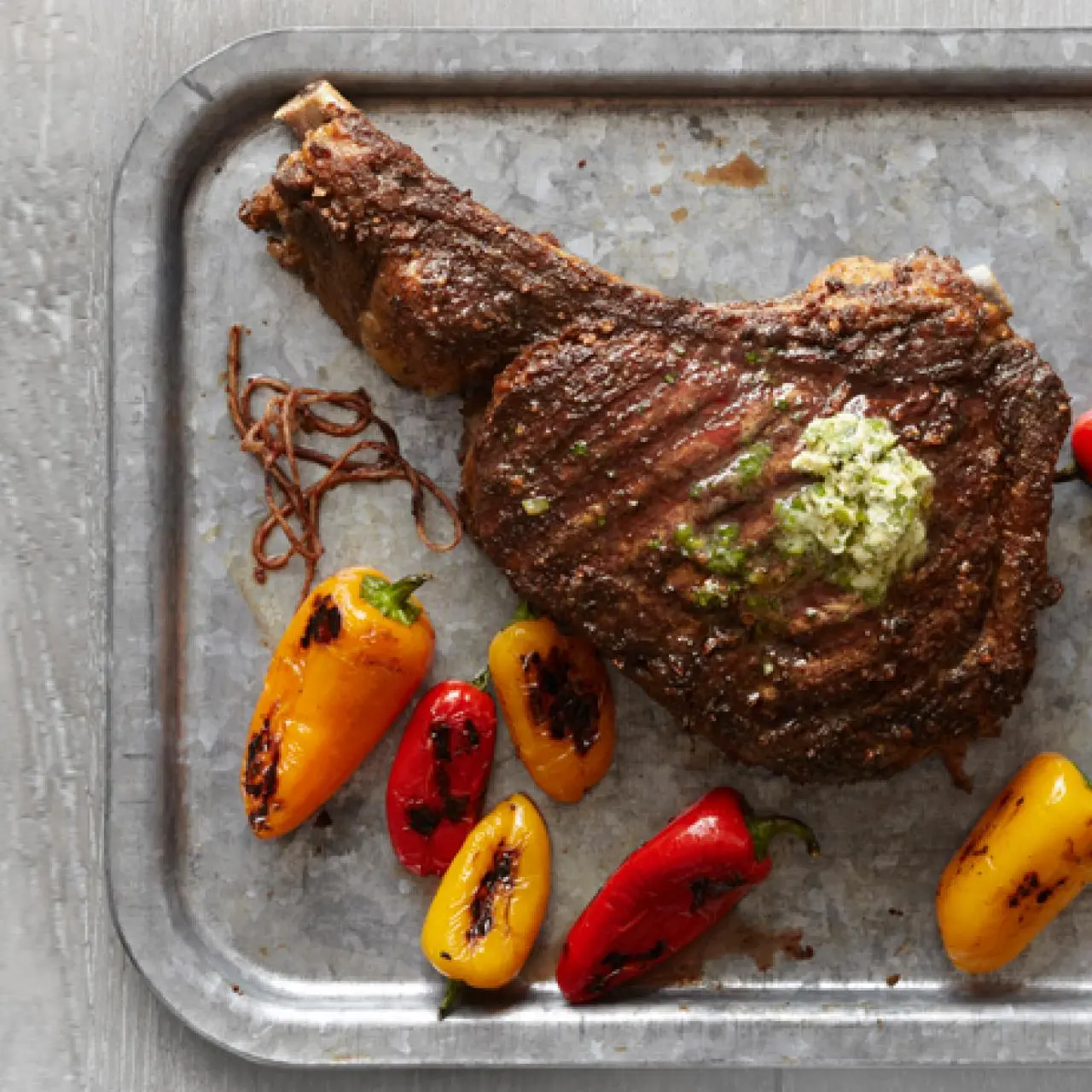 Rib-Eye Steak with Herb Butter and Charred Peppers